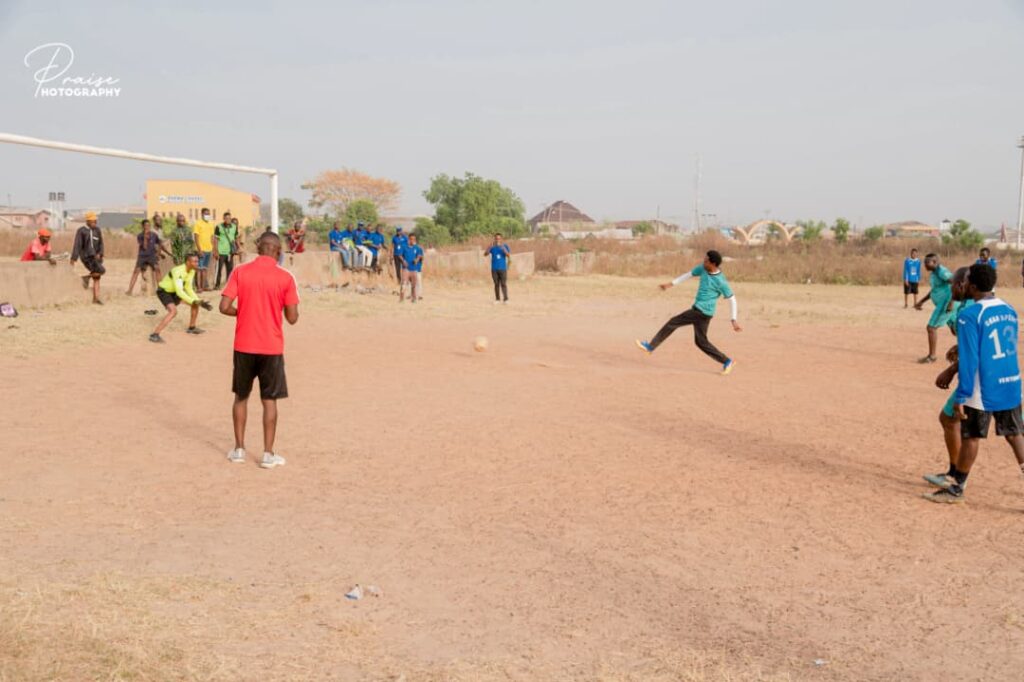 CEO of KCC Pharmaceuticals scoring at the 30th anniversary football event.
