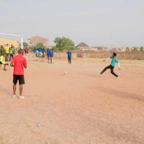 CEO of KCC Pharmaceuticals scoring at the 30th anniversary football event.
